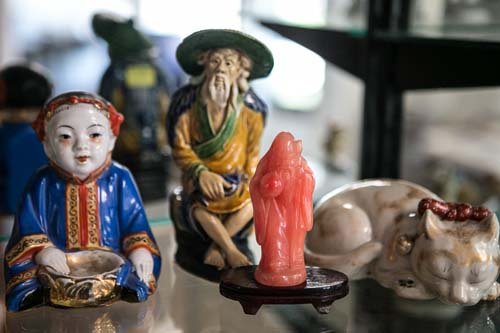 Collection of Japanese and Chinese Figurines: (Lot) Including: (1) soap stone wiseman, mudmen, 19th century porcelain seated boy, (1) 19th century Japanese Kutani sleeping cat.
