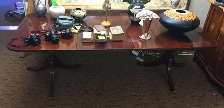 Duncan Phyfe Dining Room Table: (1) 29 1/2"h x 91"l (including 3 leaves, length without leaves 55"l) x 3' 6"w. First half of the 20th century. Mahogany with dark stained finish. Rectangular tabletop with rounded corners and a molded