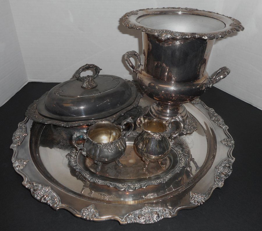 Wallace Grand Baroque Tea Set: Including: Wallace Grand Baroque Silver Plated Tea Set (1) 20"dia. Circular tray, (1) 11"h wine cooler, (1) 14"w covered dish, (1) 10 1/2"w tray, (1) sugar, (1) creamer.