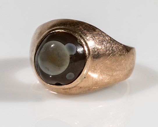 Moonstone and Gold Ring: (1) 14K yellow gold. Set with a moon stone cabochon. Total weight 4.6 grams.