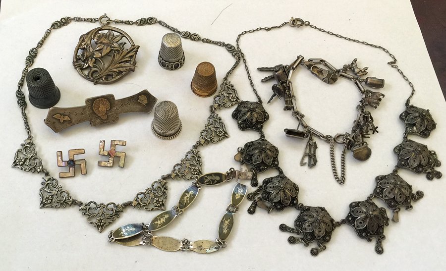 Collection of Antique Sterling Silver Jewelry: Including: (1) floral filigree pin, (3) thimbles, (1) gold plated thimble, (1) sterling and gold turkey pin, (1 pair) sterling and mother of pearl Swastika earrings, (1) German 800 silver floral neckl
