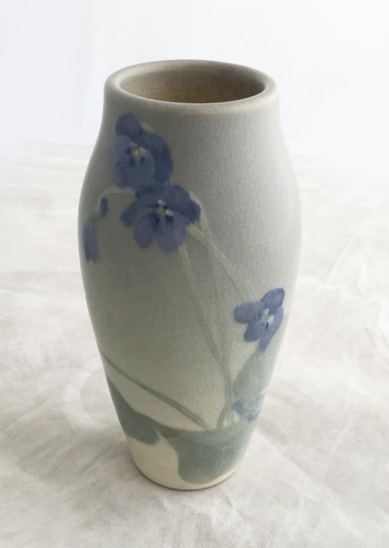 Sallie E. Coyne Rookwood Vase: (1) 6 1/4"h, Date: 1904, #30f. Artist: Sallie E. Coyne. Celadon to blue to green with violet design. Vellum glaze.