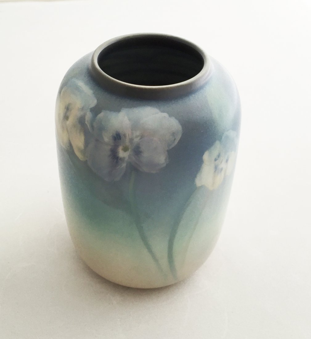 Caroline Steinle Rookwood Vase: (1) 5 1/2"h, Date: 1913, #1873. Artist: Caroline Steinle. Blue to pink with pansy design. Vellum glaze.
