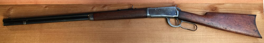 1903 Winchester Model 94 Lever Action Rifle 30 WCF: 1903 Winchester Model 94 Lever Action Rifle. 30 WCF. Blued finish. Walnut stock. S/N 237059. Plate behind trigger marked "Model 1894, Winchester, Trade Mark". 26" Octagon barrel. Note - This gun must 