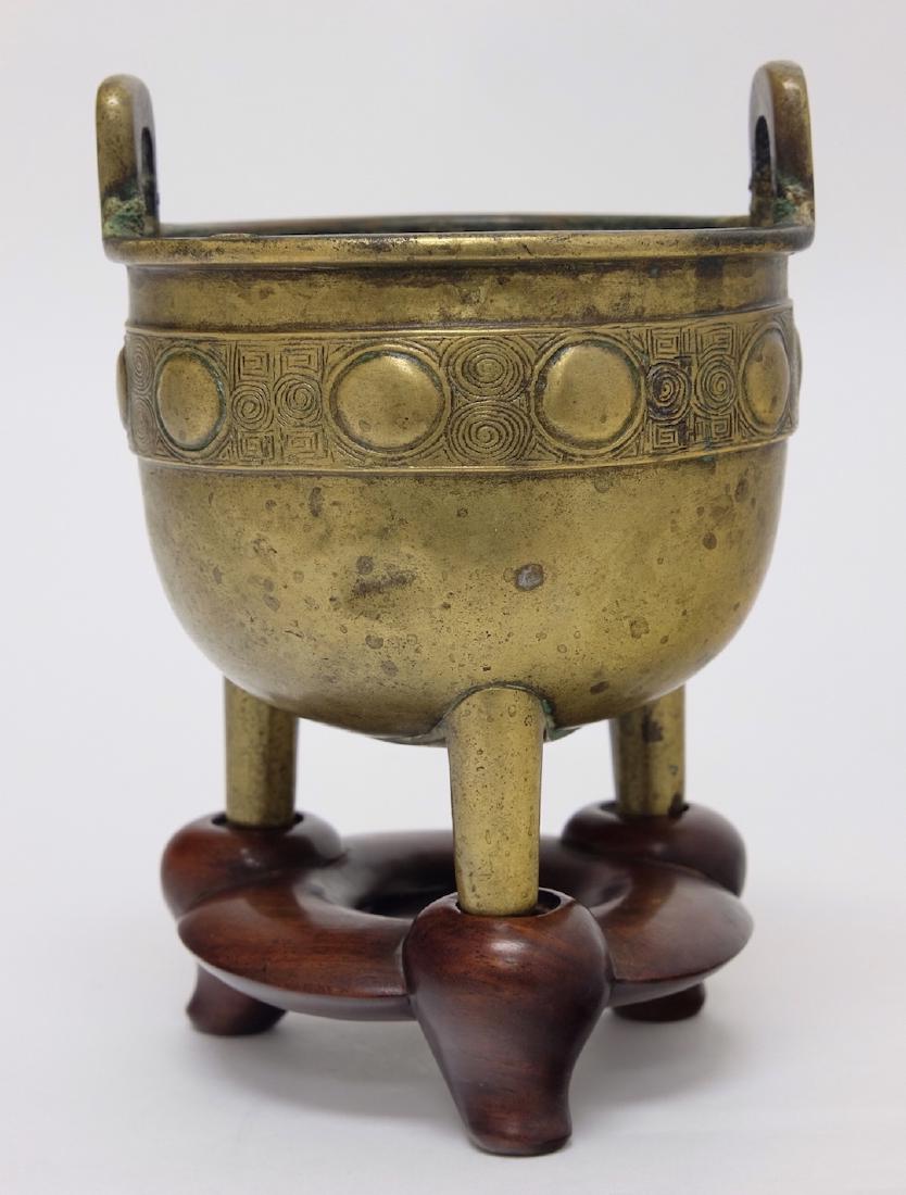 Chinese Bronze Tripod Incenser with Stand: 6.25" (16cm) tall and 4" (10cm) wide. 18/19th. C.. Good condition.