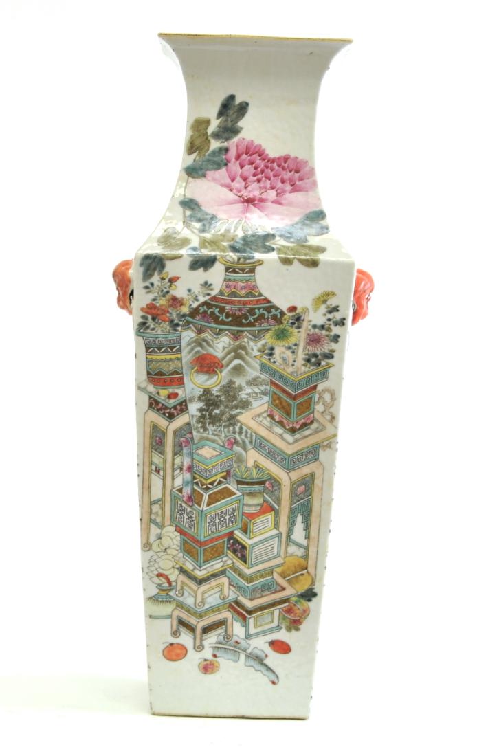 Chinese Large Famille Noire Square Vase: One side is painted in flowers and one side is painted in Foo Dogs. 22.5" (57cm) tall. 19th. C.. Good condition with a tiny almost invisible glaze loss on the bottom.