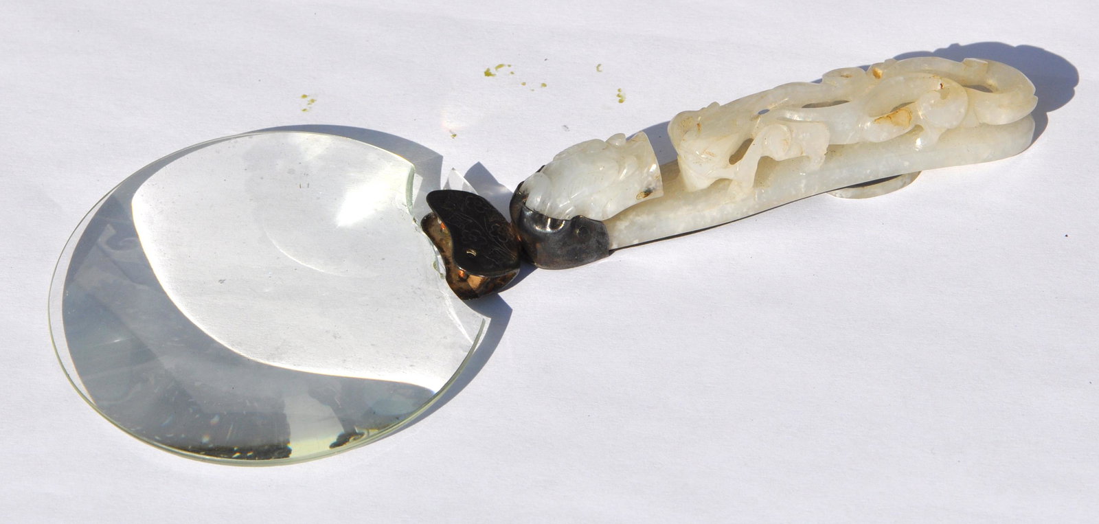 Chinese Magnifier with Jade: Magnifier set with a white jade handle. Jade only: 3.75" long. 19th. C.. The mirror is broken. Good condition with age wears. Please note: all the photos are under under natural light with different b
