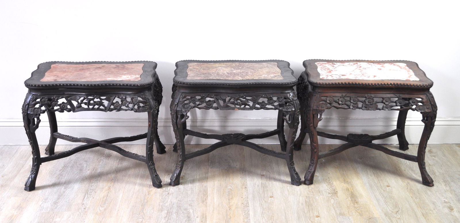 Chinese Three Rosewood Tea Tables: Inset with marble and designed in export style. One marble has a crack. 23" long by 18" wide by 19" tall. 19th. C.. Good condition with age wears other than a crack on one marble.
