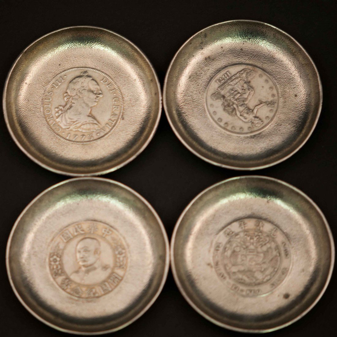 A Set of 4 Chinese Silver Coaster: Eearly republic period, 3" wide and 0.5" deep. The shipping cost is $25 plus insurance in the US (excluding Hawaii and Alaska).
