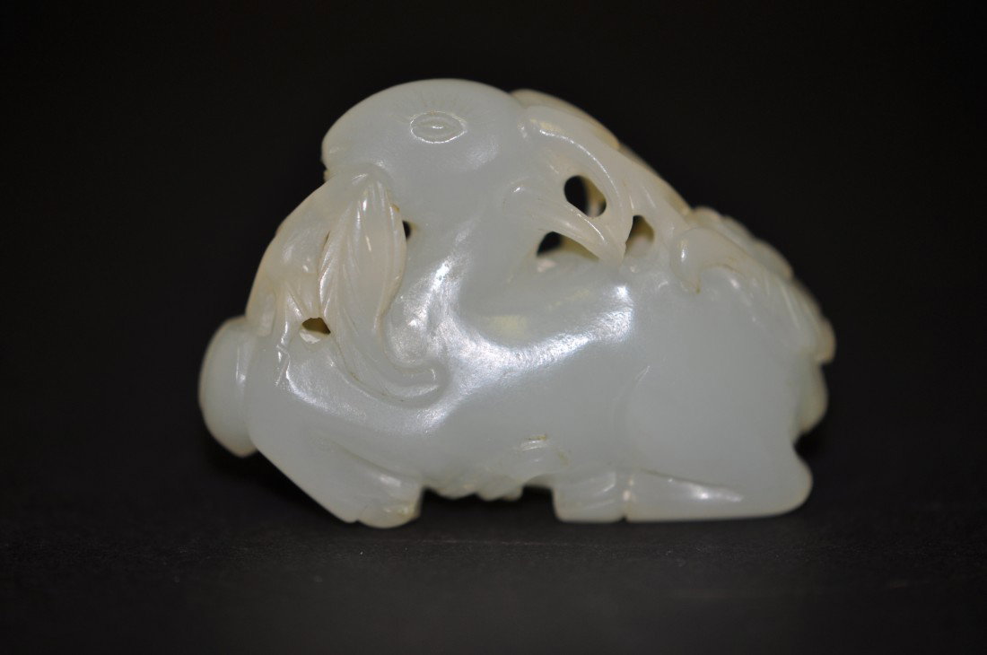 A Chinese White Jade Deer With Plant: 19th. C., 2" long, 1.5" tall. The shipping cost of this is $20 plus insurance in the US (excluding Hawaii and Alaska).