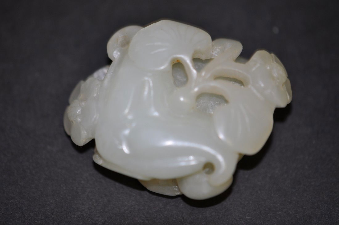 A Chinse White Jade Immortal Plant: Carved in Ling-chi form (a kind of immortal plant). 19th. C., 1.8" long. The shipping cost of this is $20 plus insurance in the US (excluding Hawaii and Alaska).