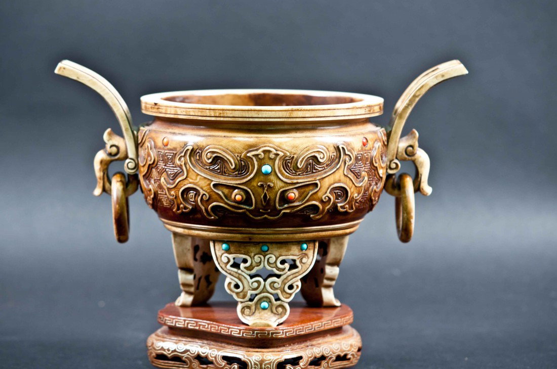 A Chinese Stained Ivory Incenser: 9" on the widest part and 6.5" tall without the stand (from the foot to the handle), 7.75" with the stand. The shipping Cost $38 plus insurance in the US (excluding Alaska and Hawaii). This piece can 