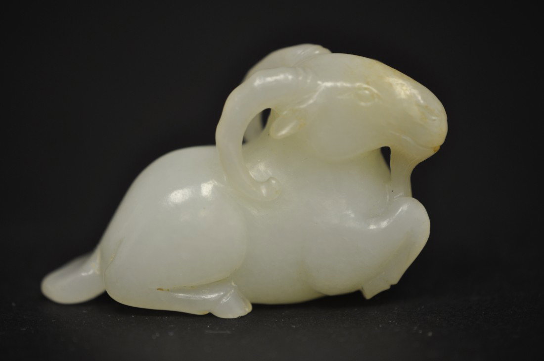 A Chinese White Jade Sheep: 19th. C.. 2.25" long and 1.4" tall. The shipping cost is $20 plus insurance in the US (excluding Hawaii and Alaska).
