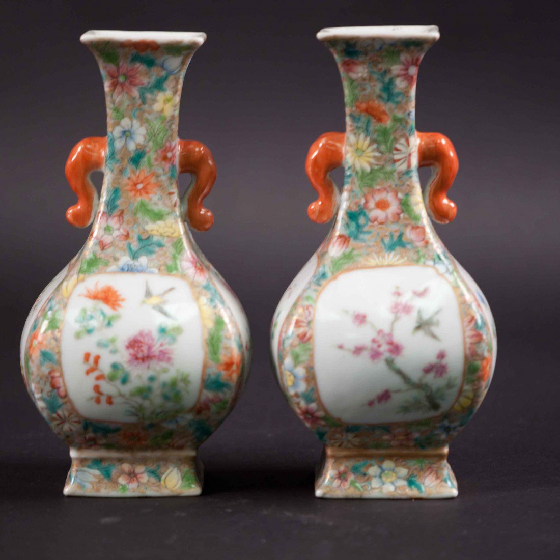 A Pair of Chinese Square Famille Rose Vases: 19th. C., 6.85" tall and 3.25" wide. The shipping cost is $48 plus insurance in the US (excluding Hawaii and Alaska).