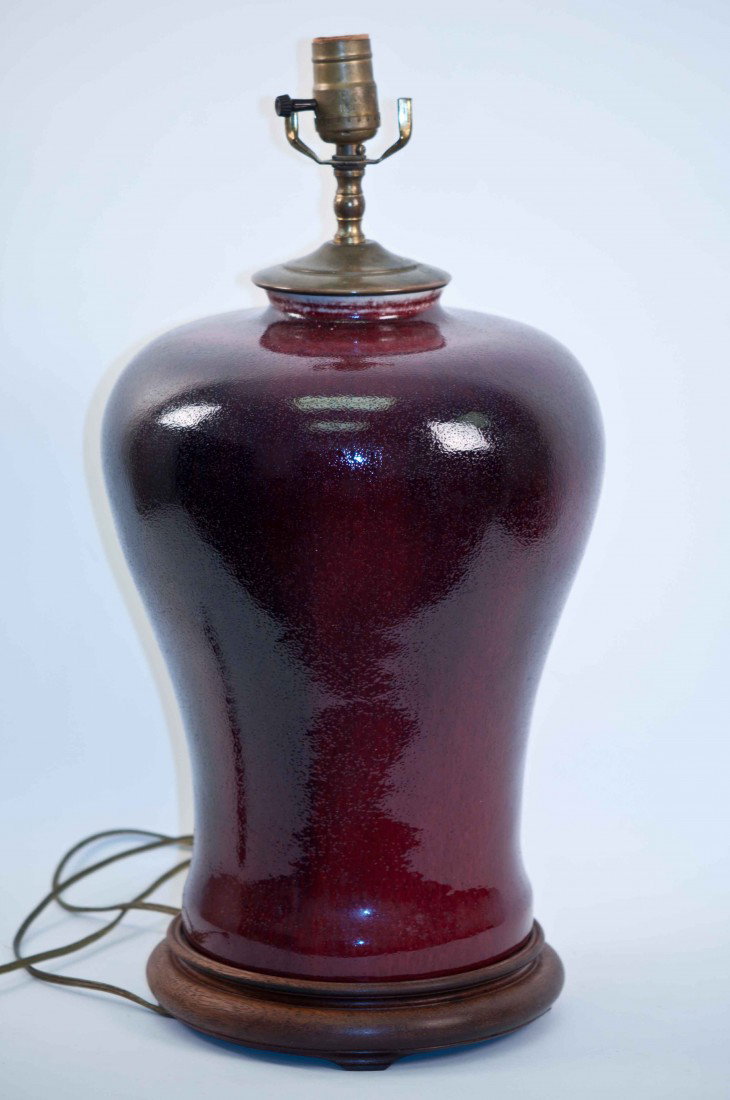 A Chinese Ox-blood Vase Mounted in a Lamp: 21" tall with the stand and hardware, 14" tall without the stand and 10.25" wide. The shipping cost is $58 plus insurance in the US (excluding Hawaii and Alaska)