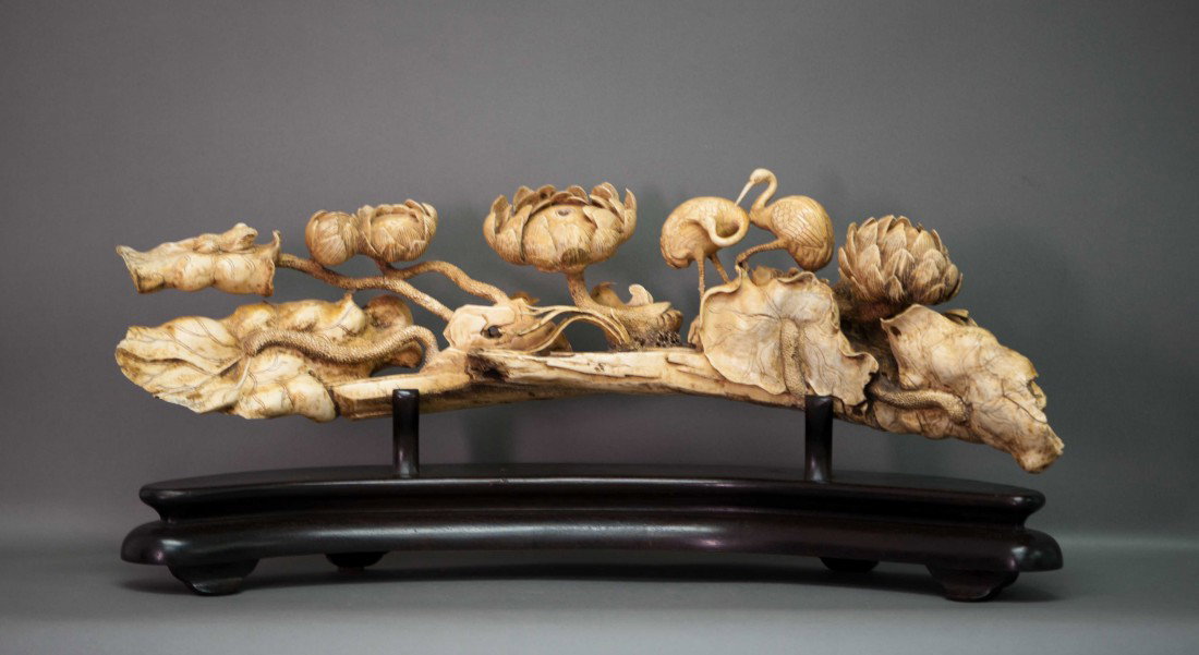 Chinese Ivory Lotus Flower and Seed: The ivory depicts a lake scene with the lotus flower petals, seeds and birds. Very ornately carved from a SINGLE PIECE, not glued together. The ivory measures 21.5" long, 6" tall weighs about 3 kg. No