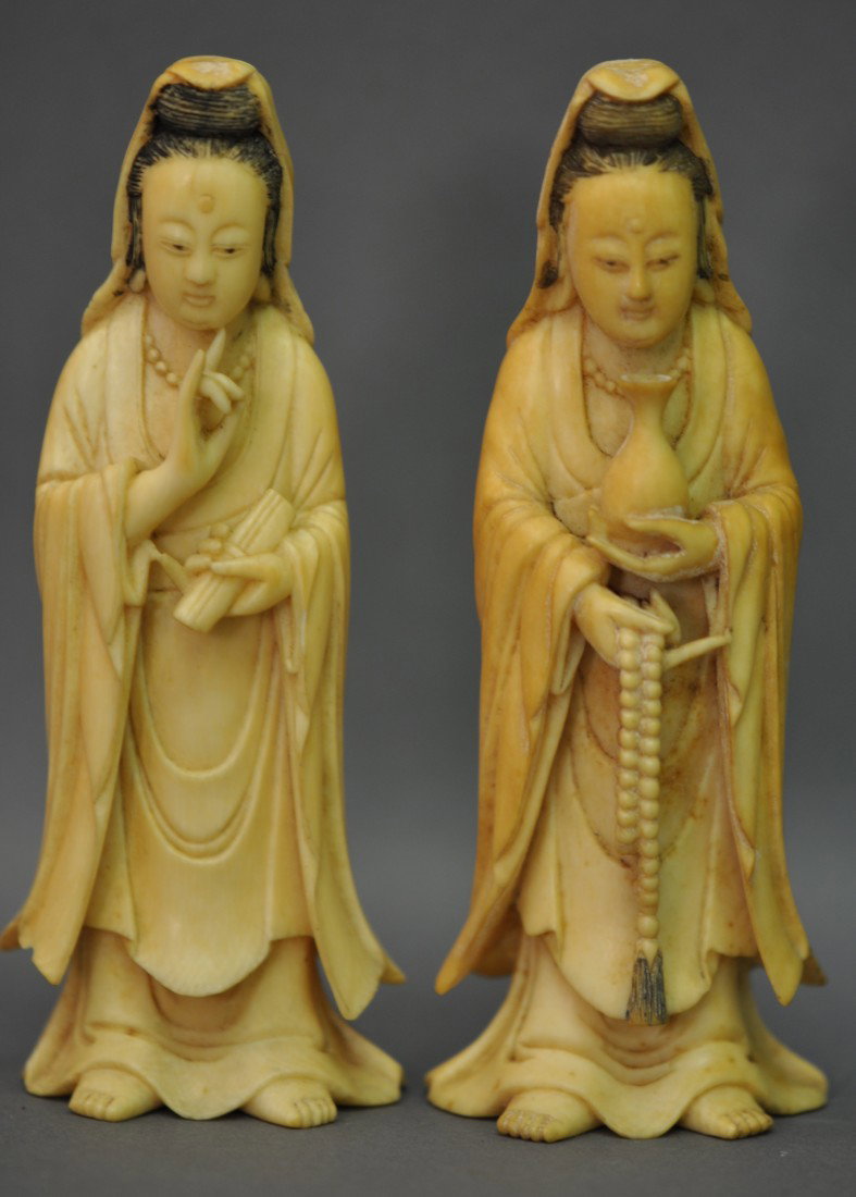 Chinese Pair of Ivory Kwan-yins: The ivory Kwan-yins measure 4.25" tall, 19th. C.. Good condition except for old age lines.This piece can only be shipped in the US.