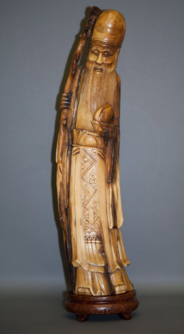 Chinese Ivory Longevity God: The Longevity God measures 13" tall and weighs 930 gs.. With some lines from the old age. This piece can only be shipped in the US.