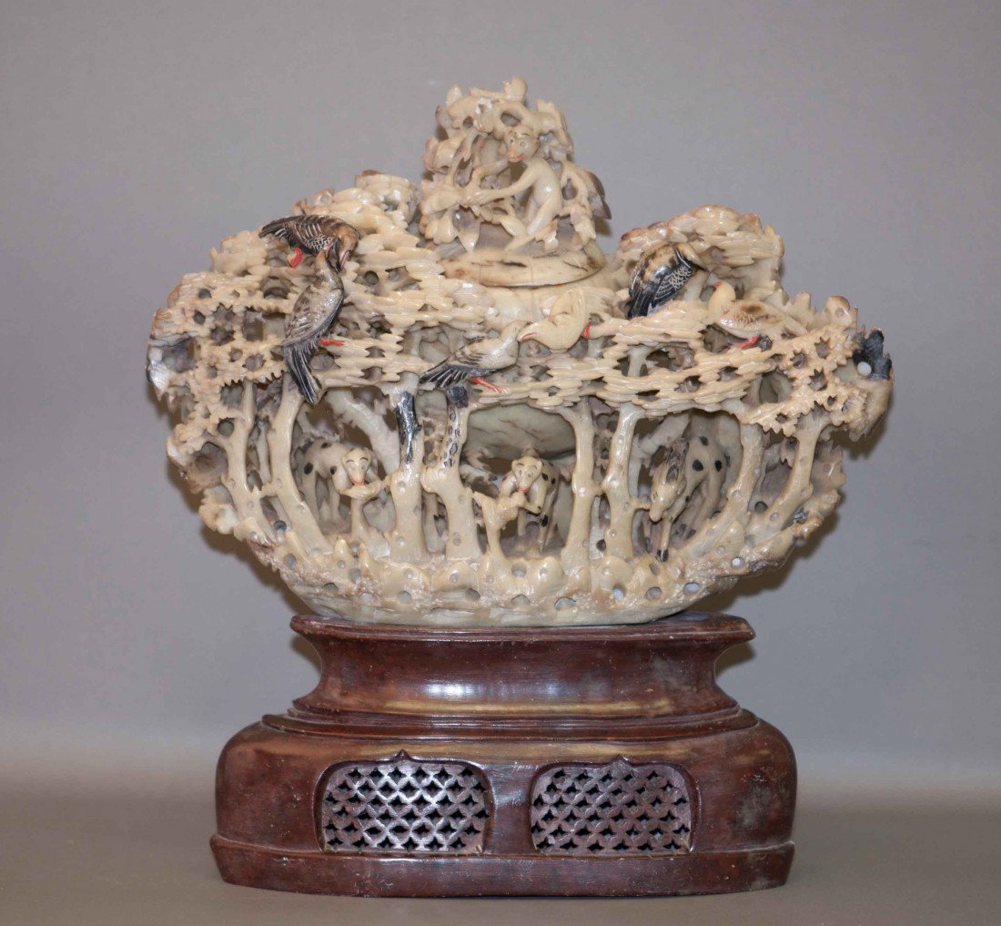 Chinese Large Soapstone Carving: The soapstone is carved intricately in monkeys, mountains and trees. It measures 11.25" tall and 10" wide. In very good condition