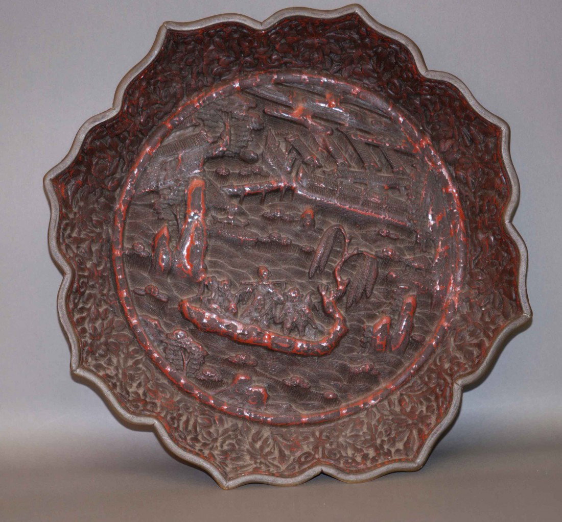 Chinese Old Cinnabar Charger: The plate is 9" wide. 19th. C. There are some chips, cracks, and age wears.