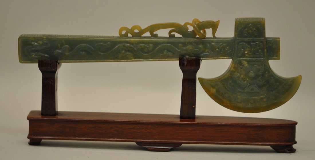 Chinese Jadeite Axe on the Stand: 翡翠斧子，後配托子。19th. C.,9" long and 3" wide. Good condition.