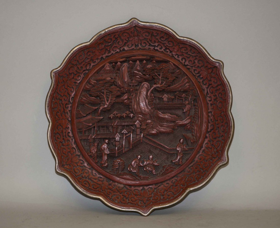 Chinese Flower-petal Shaped Cinnabar Charger: Late Ching. Marked with "大清乾隆年制”。9.25 wide. Good condition, only some wears on the gilded mark.