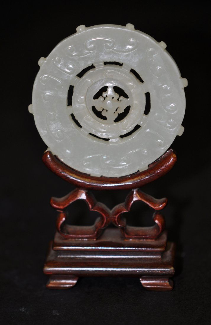 Chinese White Jade Spinner in the Middle with Ruyi: The stand is only for display, not in the sale. 2.25" (5.7cm) in the diameter. The photos with white paper are taken under natural light. Good condition. 19th. c.