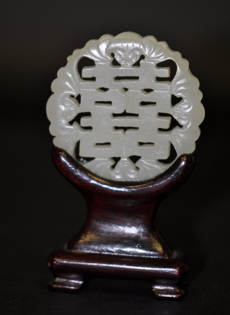 Chinese White Jade in Double Happiness Motif Plaque: The stand is only for display, not in the sale. 2.15" (5.4cm) in the diameter. Good condition. 19th. C.
