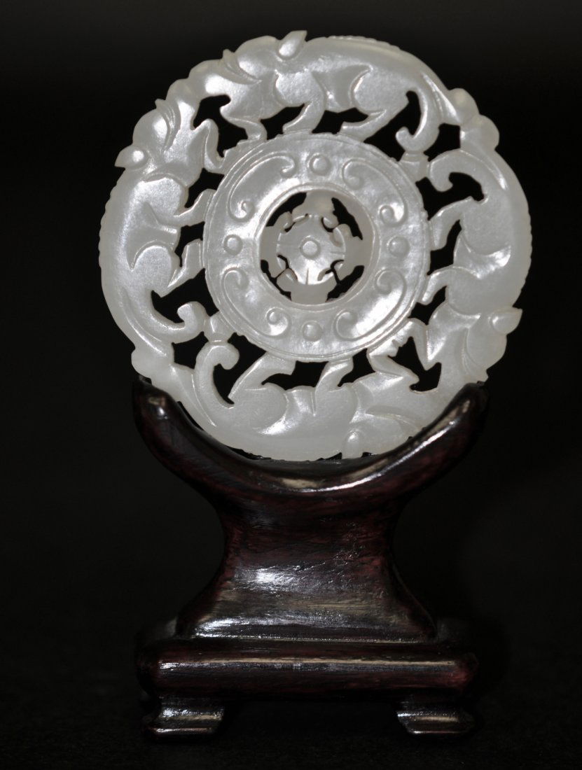 Chinese White Jade Spinner Plaque in Double Huan: The stand is only for display, not in the sale. 2.3" (6 cm) in the diameter. The photos with white paper are taken under natural light. Good condition with age wears. 19th. C.