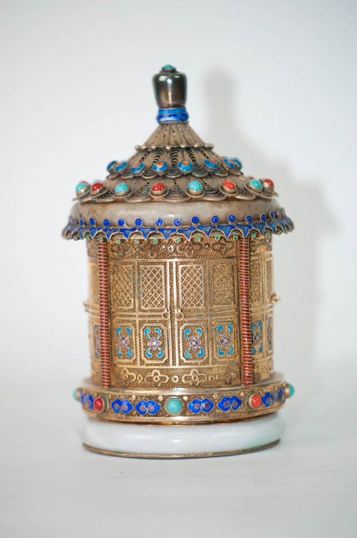 Chinese Enamel Silver Box with Precious Stones: 5.25"(13.3cm)tall,3.25"(8.3cm)in the diameter. Good condition.