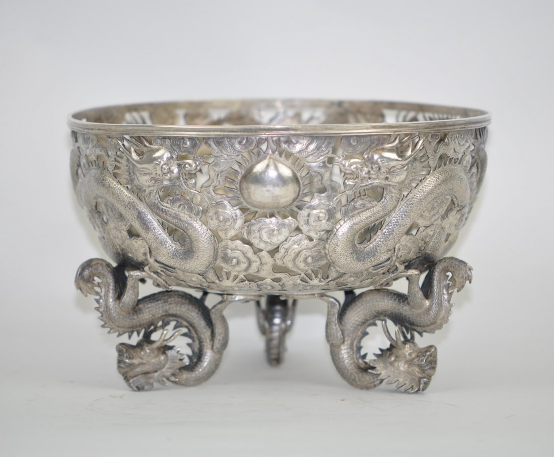 Chinese Extra Large Silver Fruit Basket Marked WH: Late 19th. C (circa 1880). Three dragons fly around the bowl and three dragons support the bowl as feet into a tripod form. Bottom marked "WH 90 (Wang Hing)" and a Chinese mark。 8“ (20.5cm) w