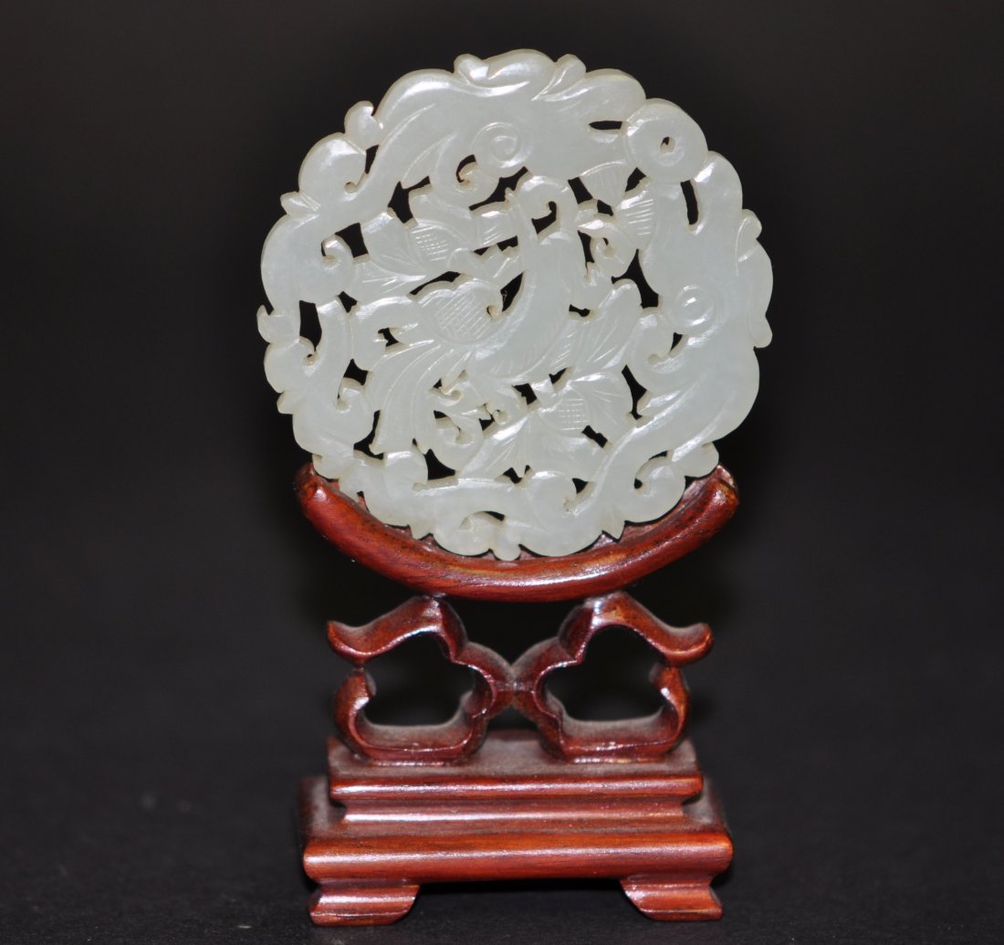 Chinese White Jade Round Plaque: 2.5" (6.5cm) across. 19th. C. Good condition. The stand is only for display, not for sale. Please be aware, : We don’t use software to change the jade color, and the photos in white background are t