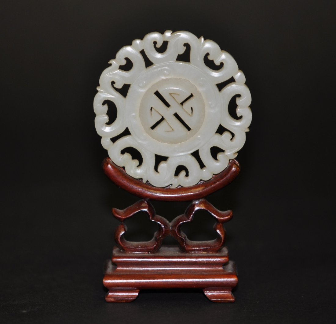 Chinese Round White Jade Plaque with Spinning Middl: 2.25" (5.7cm) across. 19th. C.. Good condition. The stand is only for display, not for sale. Please be aware, : We don’t use software to change the jade color, and the photos in white background are