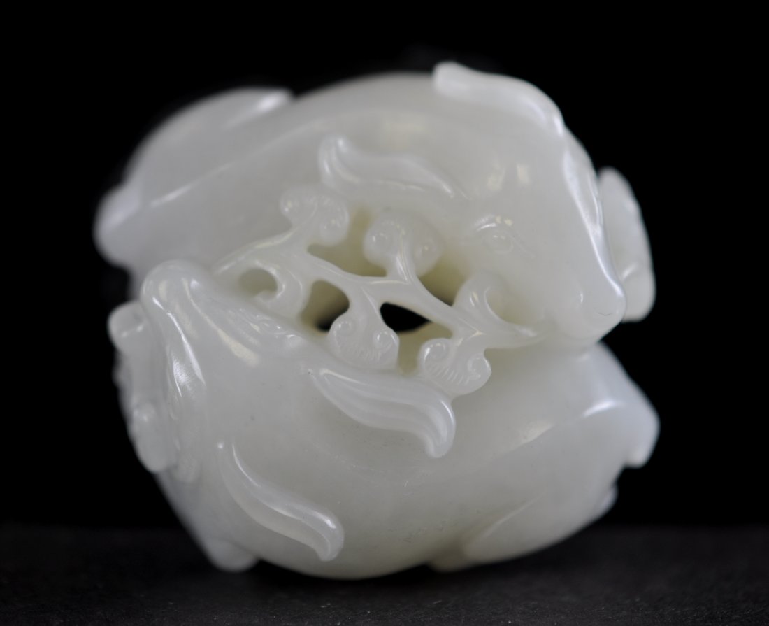 Chinese White Jade Twin Deer Biting Ling Chi Plant: 1.75" (4.5cm) across. 19th. C.. Good condition. Please note: We don’t use any software to change the jade color and the photos on white are taken under natural sunlight. 請注意A
