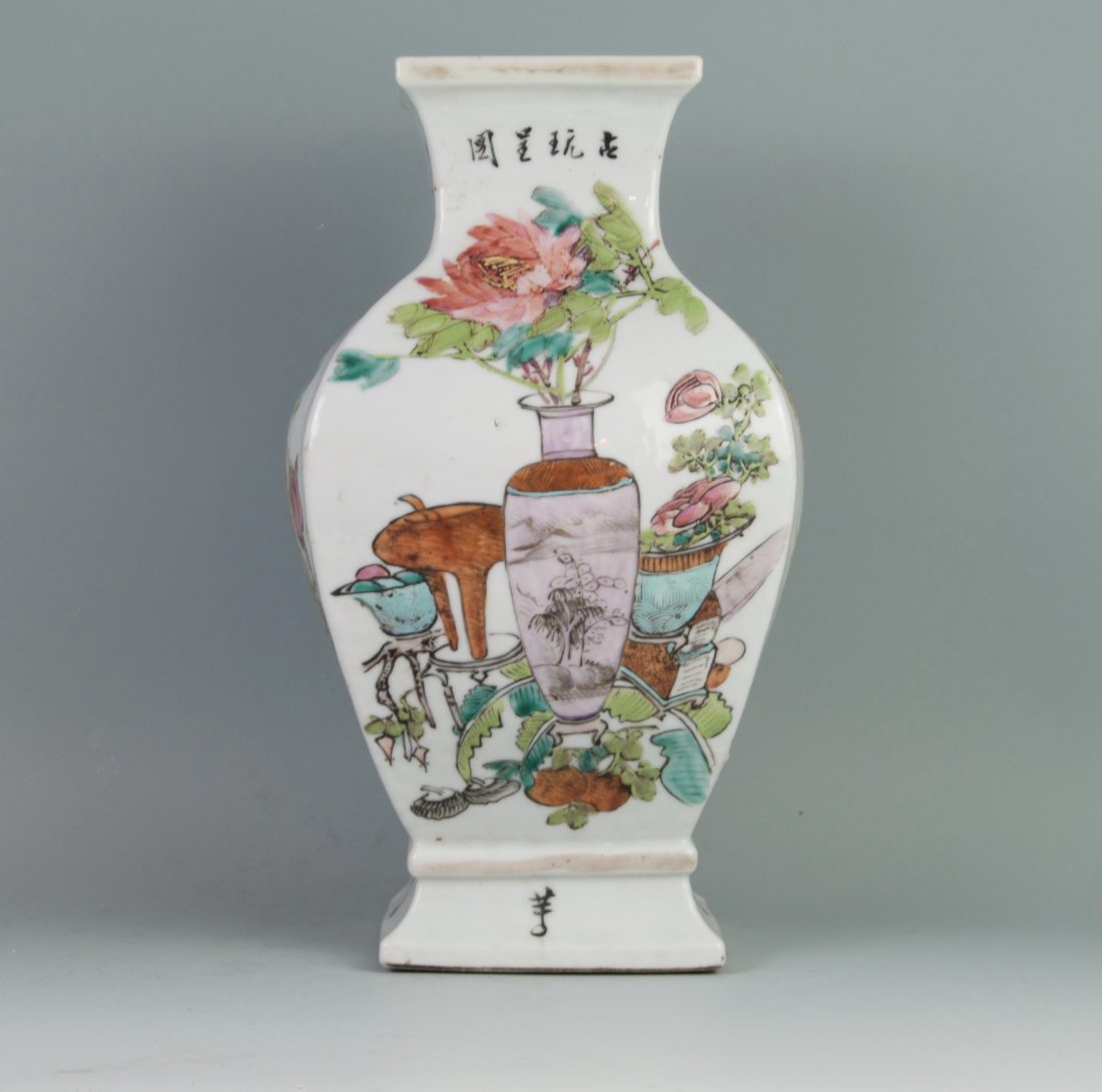 Chinese Famille Noire Vase: Painted in Bo Gu Pattern. Qian Long Mark. Late 19th. C. or early 20th. C.. 13" (33cm) tall. Good condition with a kiln imperfection on the top of one side.