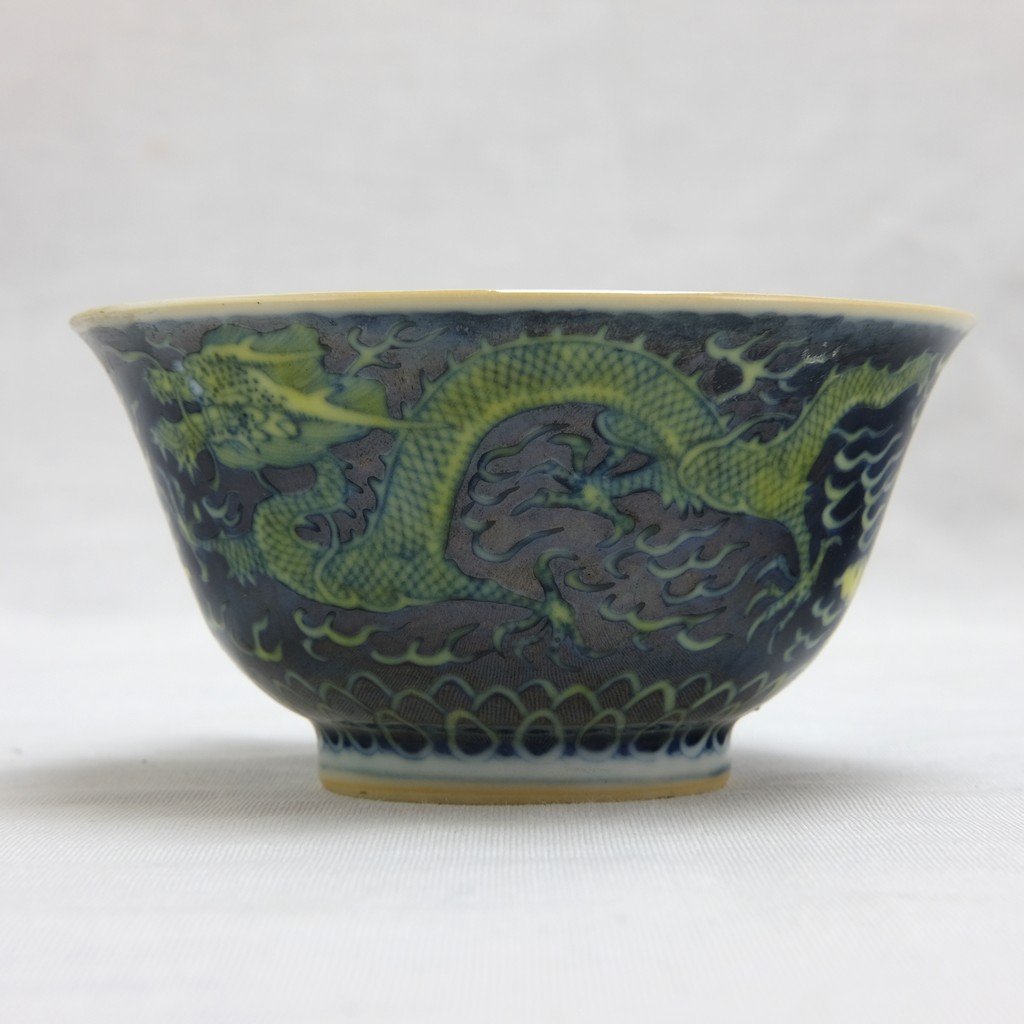 Chinese Green Ground Bowl: Possibly enameled in green ground with yellow dragons. 19th. C. "Tung Chih" mark and of the period. 4" (10cm) across. On the bottom of the bow, here's an English handwriting in Tung Chih from the Amer