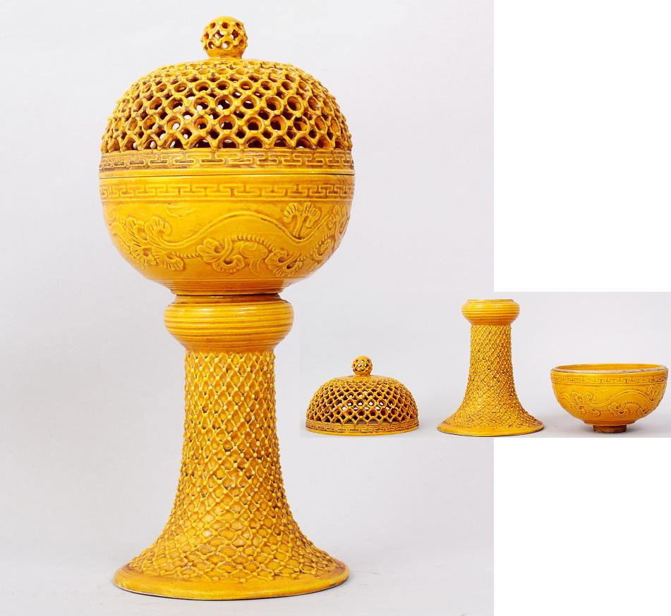 CHINESE YELLOW DETACHABLE INCENSE BURNER: TO INCLUDE THREE PARTS:PIERCED COVER,HOLDER WITH SCULPTED DRAGON,NET PATTERN STAND. 12"H. PRIVATE COLLECTION CHICAGO,ILLINOIS.
