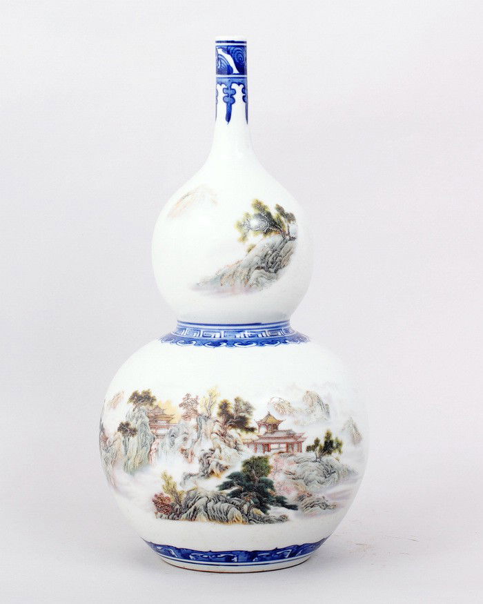CHINESE FAMILLE ROSE GOURD SHAPED VASE: FINELY PAINTED TO DEPICT TREES,BUILDINGS IN MOUNTAIN VILLAGE SCENE. 11.5"H, 5.5"W. SIX CHARACTER GREAT QIANLONG PRODUCTION IN UNDERGLAZE BLUE ON BOTTOM. PRIVATE COLLECTION GROSSE POINTE,MICHIGAN.