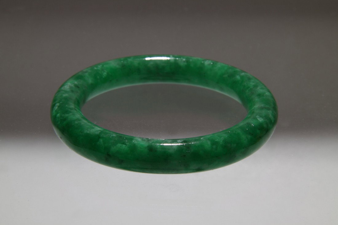 CHINESE JADE BANGLE BRACELET: CHINESE,JADE BANGLE BRACELET WITH EMERALD AND WHITE INCLUSIONS,DIA.2.5".