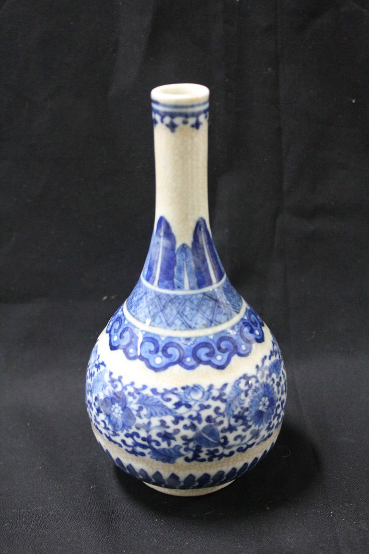 A very fine Chinese porcelain vase: with blue color floral design on white back ground, H.8",W.4.5".