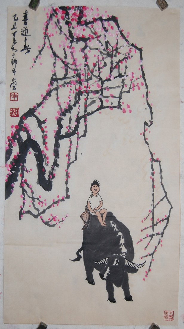 A very fine Chinese painting by LI,Keran: A fine painting ink and color on the paper by Li,Keran depicting a boy sitting on a buffalo,inscribed and signed with three seal marks,18.8"H,35"W.