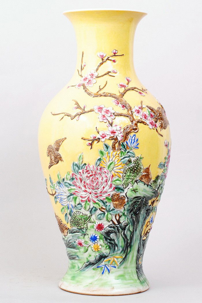CHINESE FAMILLE ROSE PORCELAIN VASE: FLORAL BASE AND RAISED DECORATIONS INCLUDE BIRDS,CHRYSANTHAMUMS,AND PEACH BLOSSOM BRANCHES.15"H,7"W. SIX CHARACTER GREAT QIANLONG PRODUCTION ON BOTTOM. PRIVATE COLLECTION GROSSE POINTE,MICHIGAN.