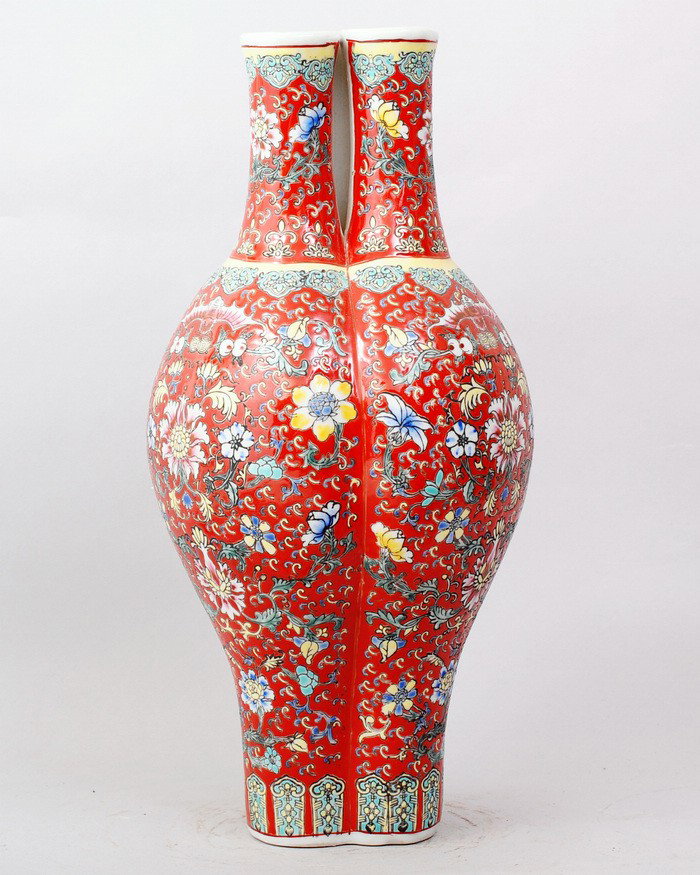 A FINE CHINESE FAMILLE ROSE TRIPLE-TEAM VASE: THREE BOTTLES COMBINE TOGHTHER,FINELY RAISE DECORATIONS ABOUT BATS AMONG THE FLOWERS.15.5"H,7.5"W. SEALED MARK ON BOTTOM,FOUR CHARACTER QIANLONG PRODUCTION.