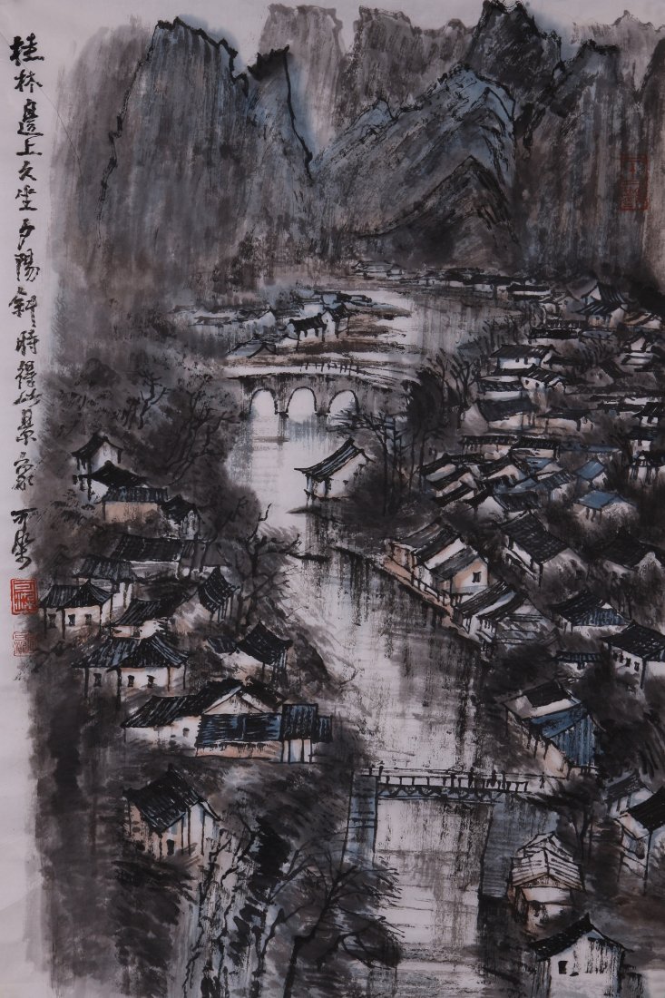 A very fine Chinese painting by Li Keran: Ink and color on paper by Li Keran depicitng a landscape of houses and mountains by the lake ,inscribed and signed with 3 seal marks.17.3"X27.2".A part of a private collection of a veteran in Michigan