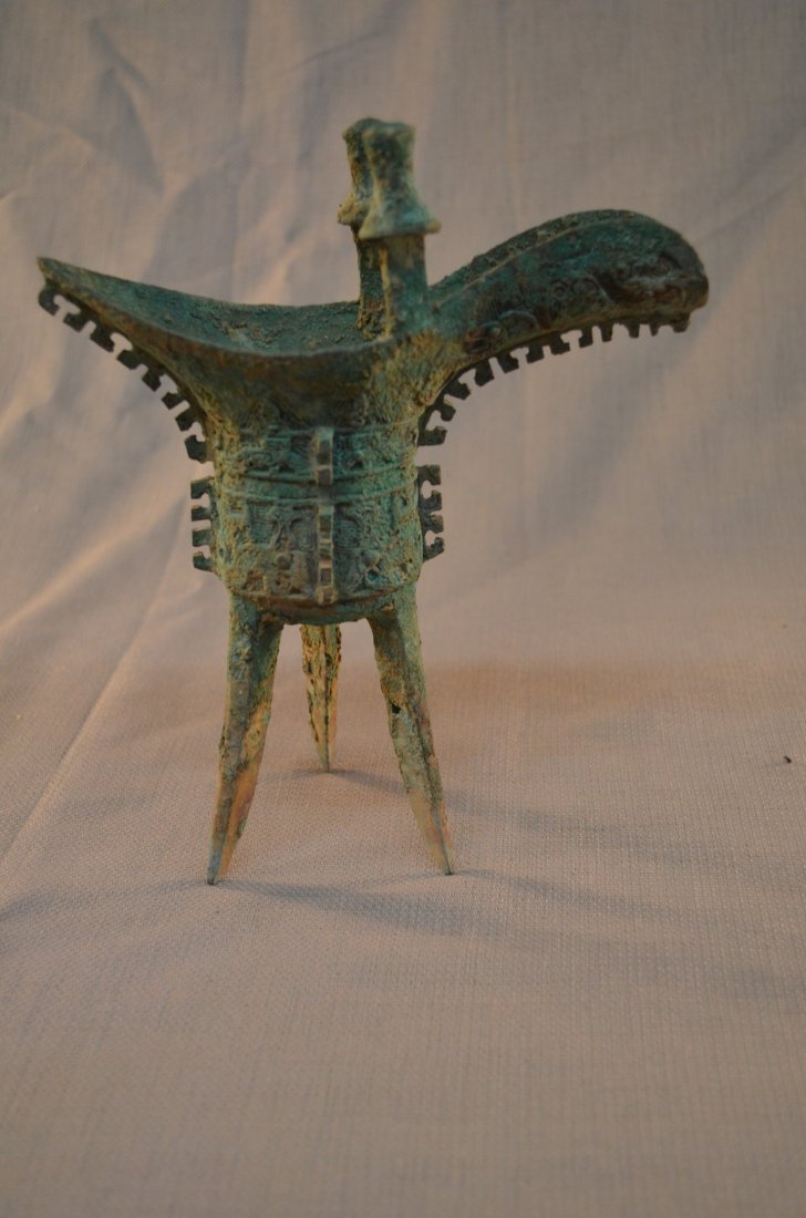 Bronze tripod: A Bronze Tripod Vessel Zhou Dynasty 10/11th Century BC ,8.5"X8"