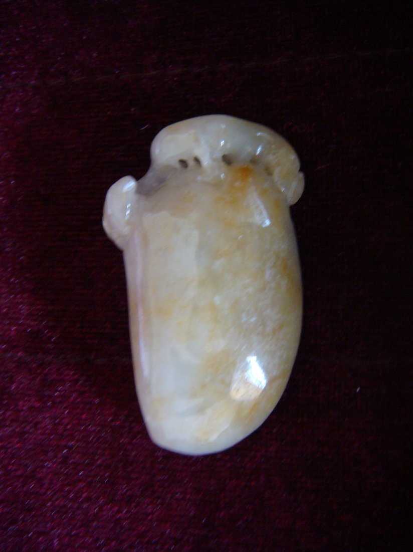 Chinese Carved Cao-Long(??) of Jadeite Pendant: Chinese carved jadeite of pendant, a piece of white tone jadeite molted yellow color, which is the sweet color of jadeite, finely carved a Cao-Long(??) (one kind of dragon) with Chang-Sheng-Guo ((???)