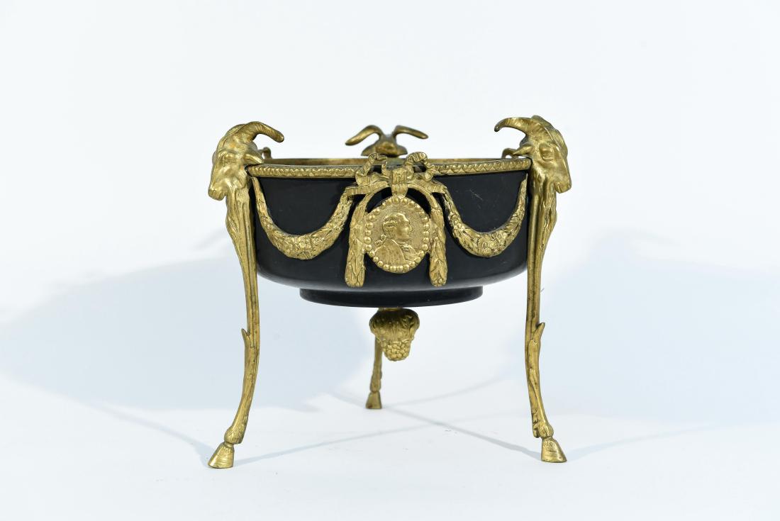 ORMOLU BRONZE PLANTER/CENTERPIECE BOWL: With ram head motif. Dimensions: H 9" x W 10.25" x D 8.75" Condition: Some black paint on gold trim. Some splotches to paint.