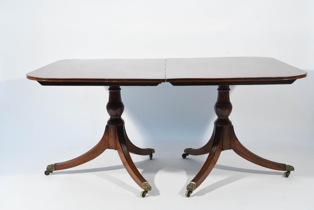 DOUBLE PEDESTAL DINING TABLE: With two extension leaves. Dimensions: (Without leaves) H 28.25" x W 61" x D 43.5" (With both leaves) W 97" Condition: Missing supports for underneath. Surface scratches. Some wear to seams where leav