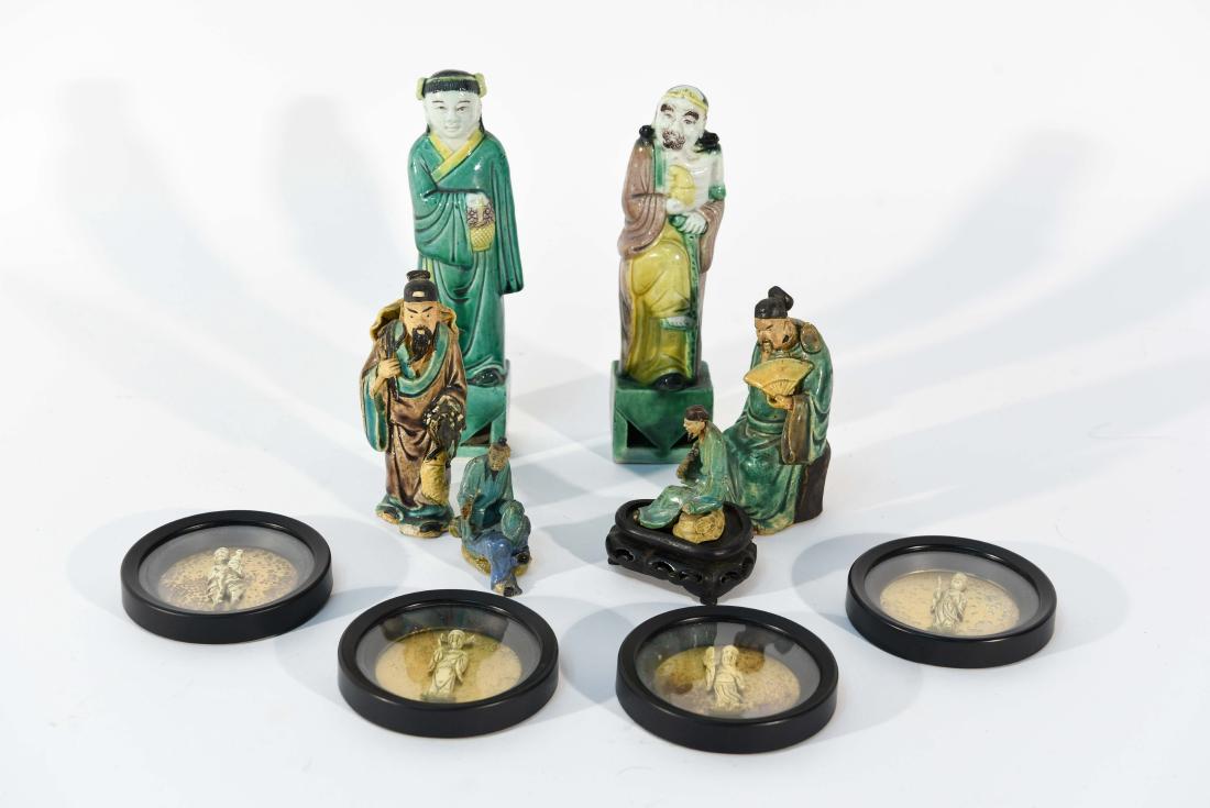 GROUPING OF CHINESE MUD MEN & FIGURAL COASTERS: Marked China to most bases. Including four Asian glass topped figural coasters. Dimensions: (Tallest) H 7.75" x W 2.5" x D 1.5" Condition: Some small chips throughout.