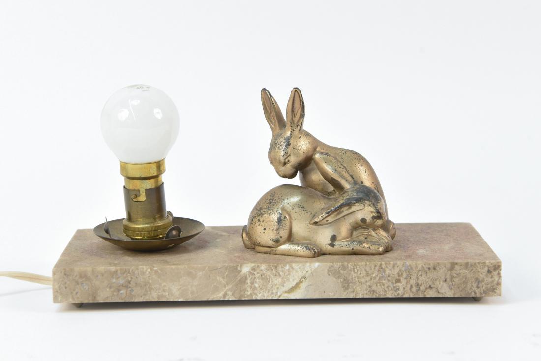 ART DECO METAL BUNNY LAMP: Dimensions: H 4.75" x W 9.75" x D 3.75" Condition: Few small flea bite chips to marble base. Finish loss to rabbits.